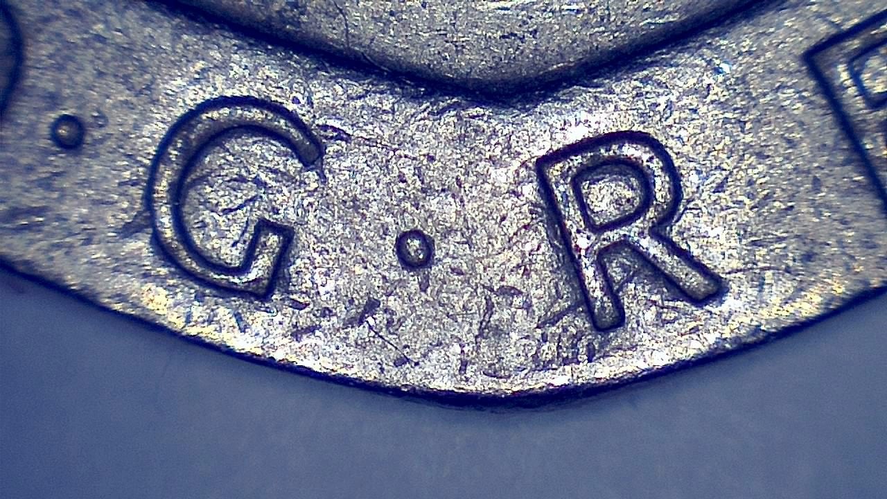 Sample microscope image showing a jewelry hallmark or maker mark